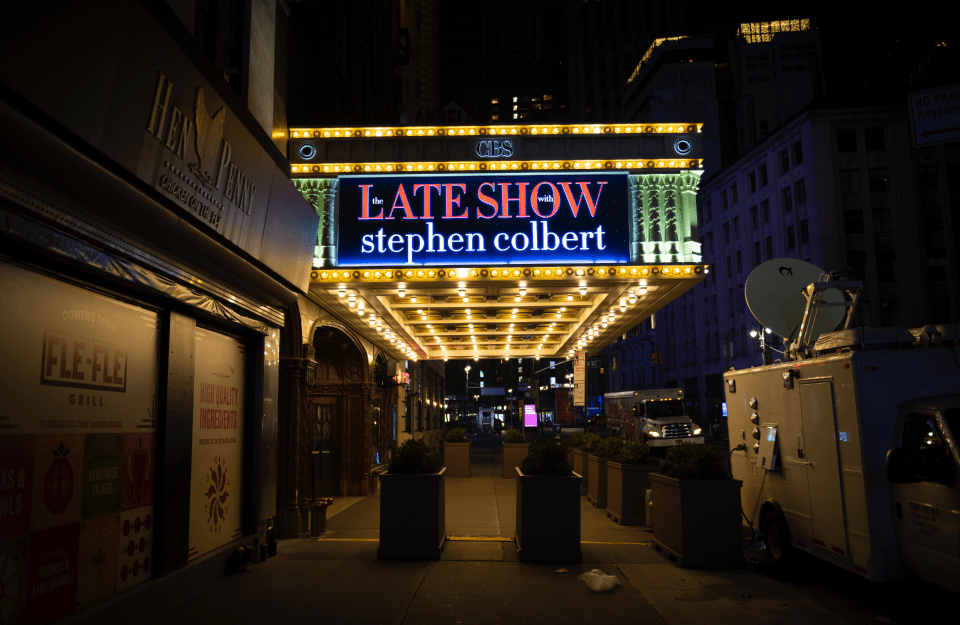 The late show with Stephen Colbert sign lit up outside, photo credit iStock / Joel Carillet